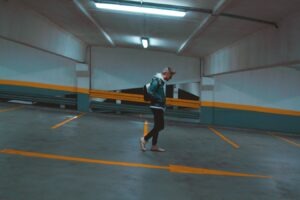 pedestrian walking through mostly empty parking garage