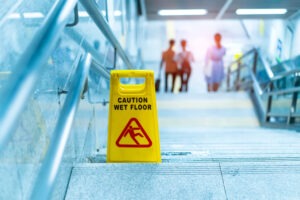 Caution wet floor" sign in stairs