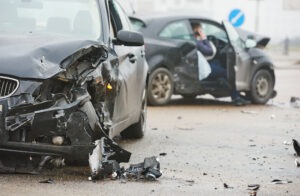 black car crashed into another black car